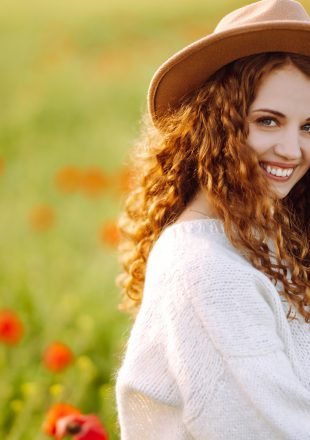 Young woman walking in amazing poppy field. Nature, vacation, relax and lifestyle. Young woman walking in amazing poppy field. Nature, vacation, relax and lifestyle.